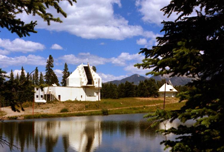 In 1956, HAO built the world’s first K-coronameter (the Mk1) and deployed it to Climax. The K-coronameter was designed to view polarized light from the Sun that is scattered in the outer solar atmosphere known as the corona. Light is polarized when many of the light waves vibrate in a preferred direction (determined by the magnetic field) instead of vibrating in random directions. Detection of this polarized, scattered light allowed HAO scientists to measure the brightness of the corona out to greater heights. Climax observations of the corona revealed that the brightness of the corona changed over the 11-year sunspot cycle, with the brightest parts being located over regions where the magnetic field was strongest: sunspots and active regions. HAO scientist, Gordon Newkirk, produced a sophisticated model of coronal density and magnetic field in 1958, based on the interpretation of coronal data from Climax. It remained a standard reference model for many decades. The Climax observatory continued to acquire important observations of the Sun and remained HAO’s primary observing site until it closed in 1972.