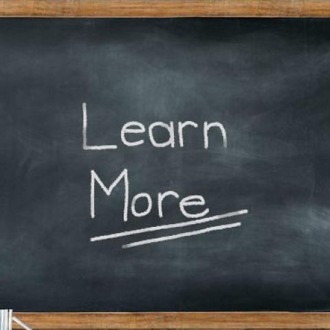 Blackboard with 'learn more'